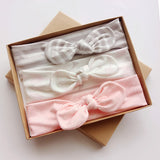 Three bows with bows with a gift box