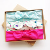 Three bows with bows with a gift box